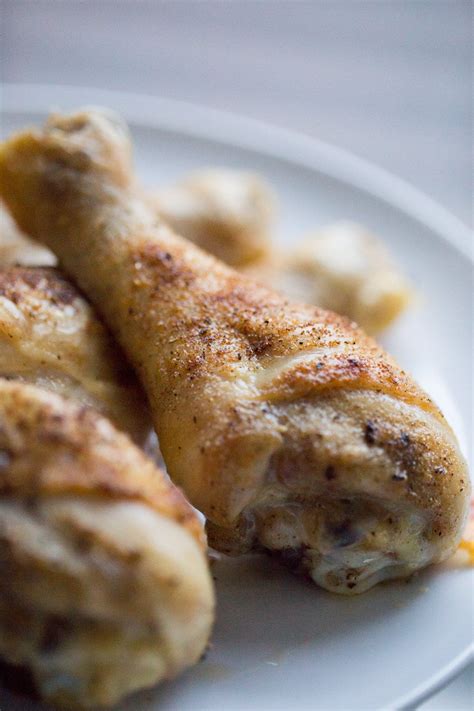 This baked chicken legs recipe makes crispy chicken drumsticks with tender, juicy meat in 30 minutes. Baked Chicken Legs | Lauren's Latest