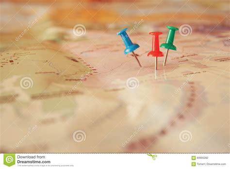 Pins Attached To Map Showing Location Or Travel Destination Stock