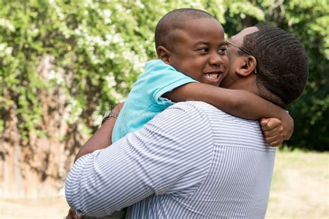 African American Father And Son Hugging Stock Photo Image Of