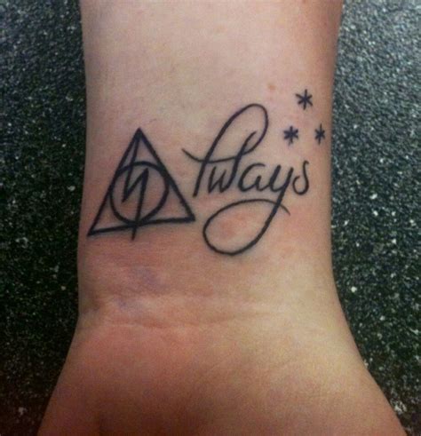 In this harry potter tattoo design negative space creates the deathly hallows symbol among carefully shaded flowers. Always | Harry potter tattoos, Tattoos, New tattoos
