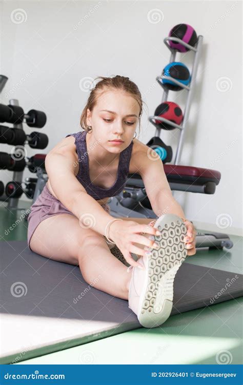 Young Girl In A Gym Does An Stretching Exercise Stock Image Image Of Active Athletic 202926401