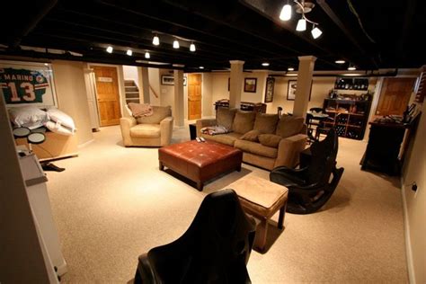 Add string lights to basement ceiling. exposed ceiling painted black with nice lights | Basement ...