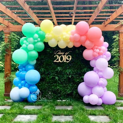 Pastel Organic Balloons Arch With Grass Wall Backdrop Balloon Arch