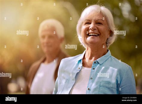 Mature Senior Couple And Woman Portrait In Nature For Fun Bonding And Loving Adventure