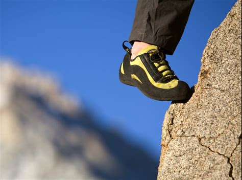 A Climbers Foot In A Shoe On A Foothold Climbing