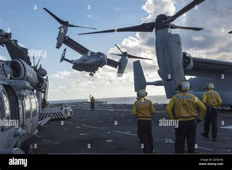 Us Sailors Watch As A Marine Corps Mv 22b Osprey Tiltrotor Aircraft