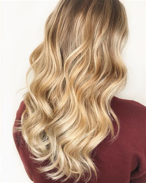 long wavy formal hairstyle honey blonde hair color