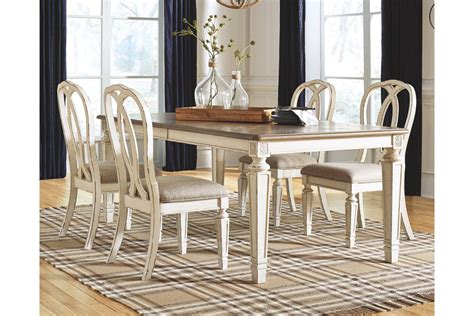 Farmhouse style has taken center stage in the interior design world and we are loving all the various takes on it. Realyn Dining Extension Table | Ashley Furniture HomeStore ...