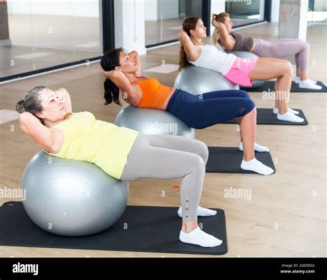 Women Doing Crunches On Stability Balls Stock Photo Alamy