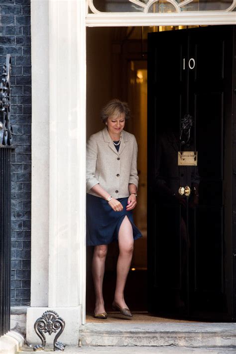 Prime Minister Theresa May Flashes Her Leg As She Steps Out Of No Downing Street To Meet European