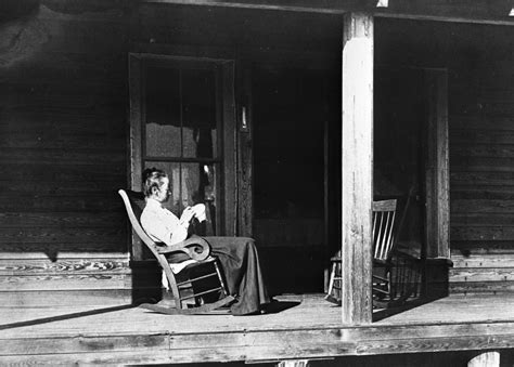 Florida Memory • Henriette Martens Sitting In A Rocking Chair On The Porch Of Her Home Miami