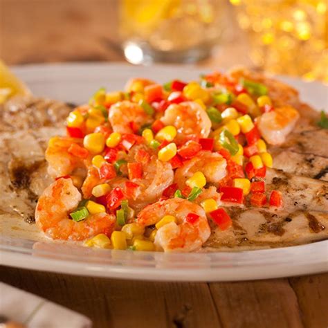 Fillet the fish and leave the skin on, then make a few light relief cuts in the skin. Grilled Redfish with Shrimp and Corn Maque Choux | Recipe ...