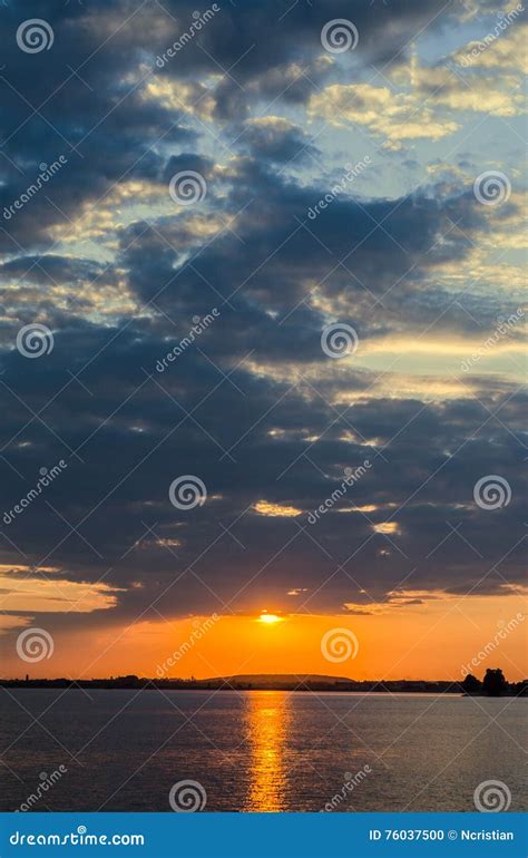 Orange Sunset Over A European Lake Blue Clouds Sky Colored Dra Stock