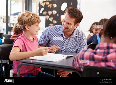 Children Helping Each Other Classroom Hi Res Stock Photography And