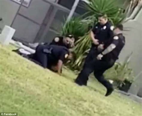 Miami Officer Suspended After Video Of Suspect Being Daily Mail Online