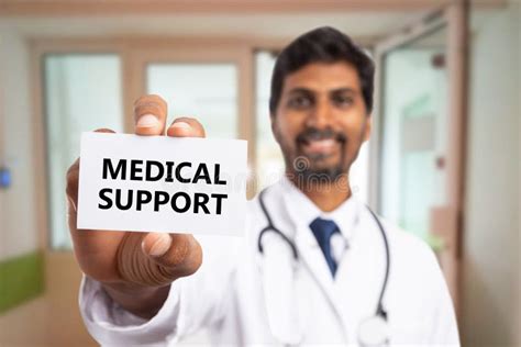 Doctor Presenting Medical Support Text On Card Stock Photo Image Of