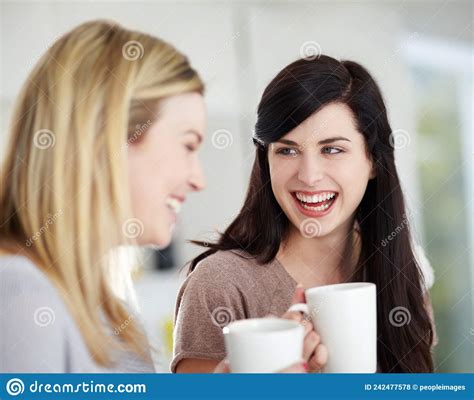 Doing Some Catching Up Two Happy Young Women Having Coffee Together At
