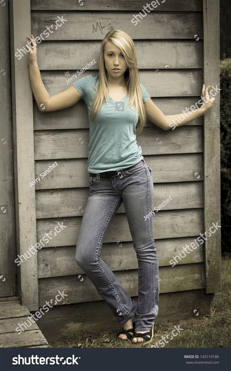 Full Body Portrait Picture Of A Teenager In Jeans And