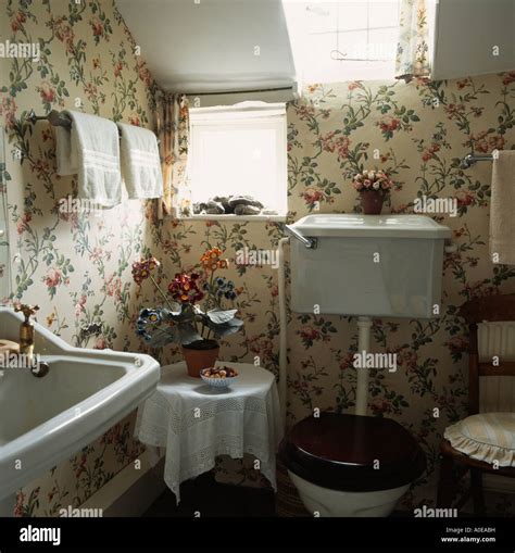 Country Cottage Bathroom With Floral Wallpaper Stock Photo Alamy