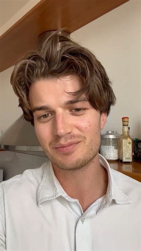 A Close Up Of A Person Wearing A White Shirt