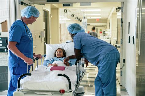 Nurses Talking To Girl In Hospital Gurney Stock Photo Dissolve