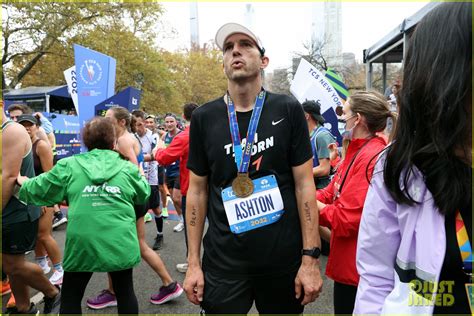 ashton kutcher races to finish line during new york city marathon and raises money for charity