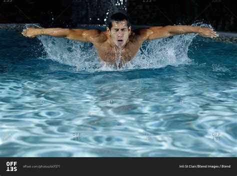 Pacific Islander Man Swimming In Swimming Pool Stock Photo Offset