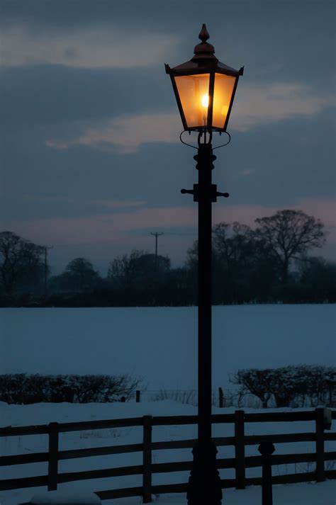 A Traditional Victorian Lamp Post Glowing On A Winters Evening