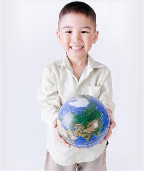 Child Holding A Globe In His Hands With Images Multicultural Books