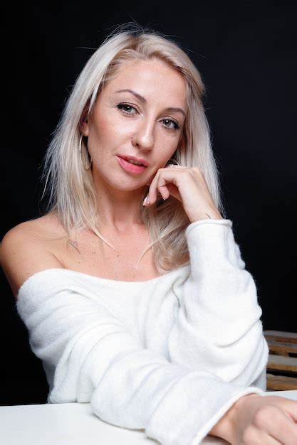 Premium Photo Portrait Of A Beautiful Attractive Woman In A White Sweater