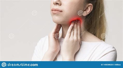 Woman With Thyroid Gland Problem Touching Her Neck Stock Photo Image