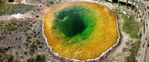 An Aerial View Of A Green And Yellow Crater