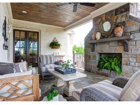 Celebrating the best of southern life. Southern Living Idea House beautiful porch with stone fireplace | Living design, Southern house ...