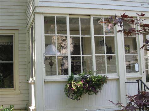 Open decks and porches can be modified and enclosed with fixed or motorized screening systems. Glass enclosed back porch... goes across the back part of ...