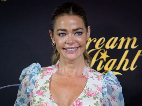 Denise Richards Teases Clip Of Photo Shoot In A Low Cut Black Dress