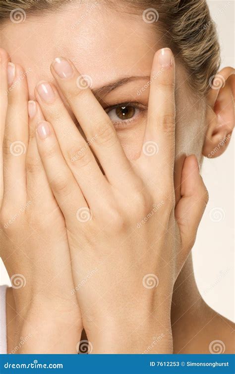 Girl Covering Her Face With Hands One Eye Exposed Stock Image Image