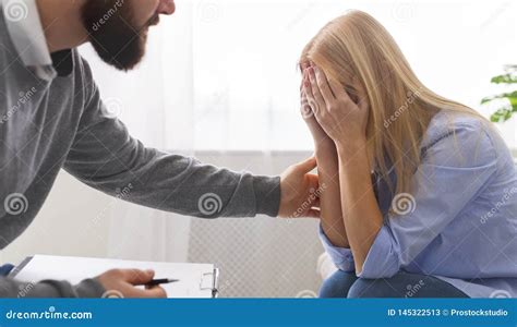 Millennial Woman Crying Therapist Supporting Her At Personal Meeting