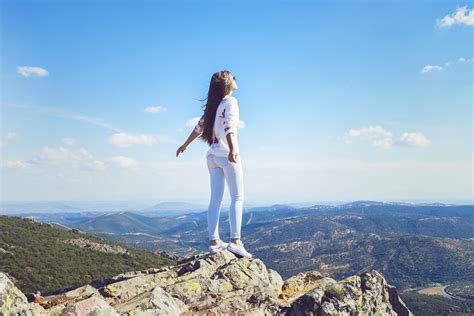 Girl Mountain Jeans Wind Hair Pose Standing Wallpapers Hd