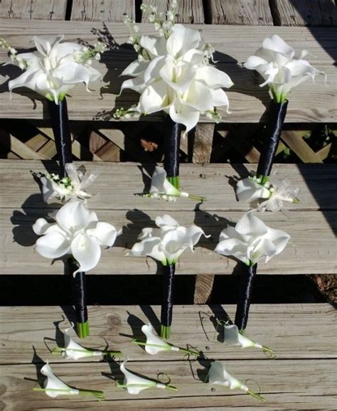 Aisle and altar flowers bridal bouquets wedding party groom, best man and groomsmen mothers and fathers maid of honor and bridesmaids aisle arrangements altar.a.d. Black Ivory White Bouquet Boutonniere Calla Lily Corsage ...