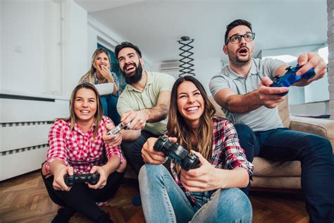 Group Of Friends Play Video Games Together Find The Latest Tv News And Updates At Cheap Tvs Blog