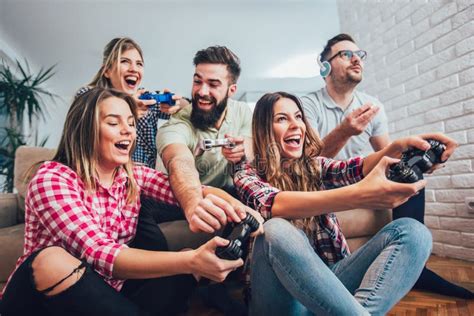 Group Of Friends Play Video Games Together At Home Stock Image Image Of Button Popcorn 116806491