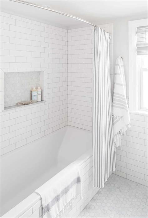 Subway tiles in a traditional brick pattern has been king of the bathroom and kitchen backsplash, but what's next? small-bathroom-renovation-white-subway-tile-centered-by ...