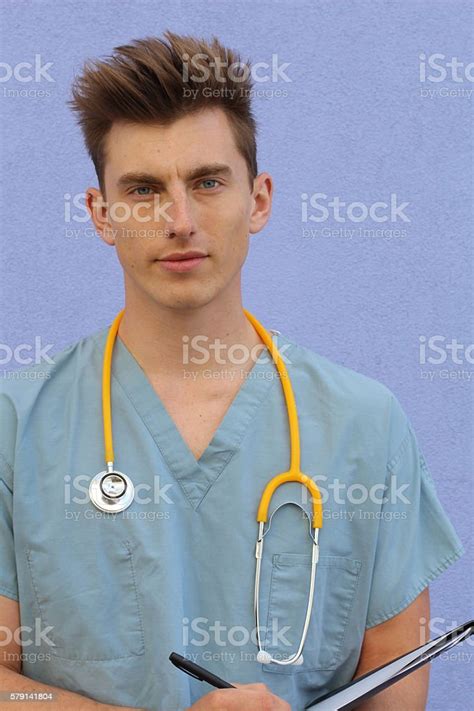 Portrait Of A Smiling Handsome Doctor Stock Photo Download Image Now