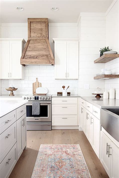 Our farmhouse kitchen previously had a useless downdraft in our counter top. Our white modern farmhouse kitchen with custom wood hood ...