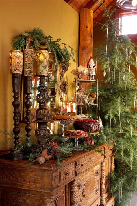a christmas tree sitting on top of a wooden table next to a dresser