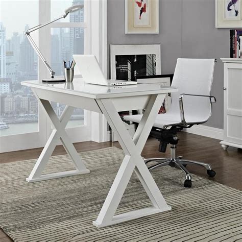 A White Desk With A Laptop On It In Front Of A Window And A Rug