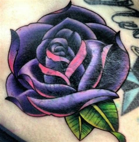 This pink and purple rose is fit for a fairy queen. Traditional style Purple Rose Tattoo | Rose tattoos for ...