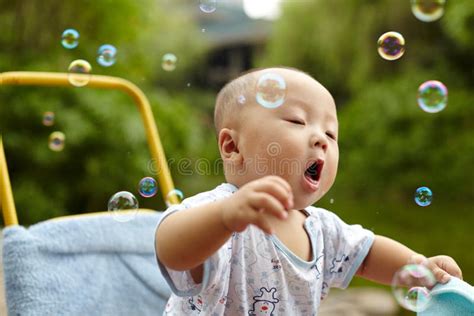 Kid Catching Soap Bubbles Stock Photo Image Of Happiness 43377398