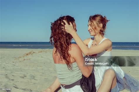 happy gay couple spending happy time together couple of lesbians have fun on the beach beautiful