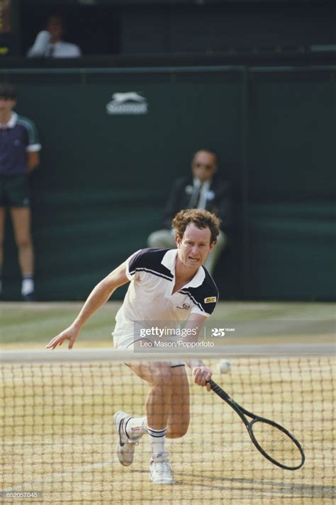 American Tennis Player John Mcenroe In Action Competing Against Jimmy